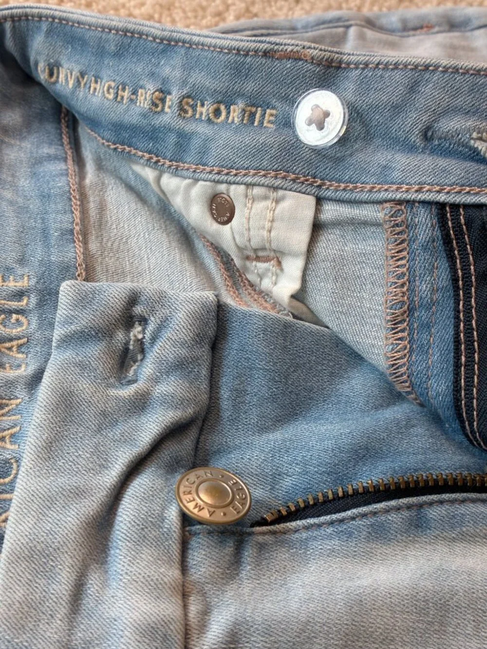 American Eagle Curvy High-Rise Shortie Stretch Jean Cross-Front Button Shorts - Picture 6 of 14